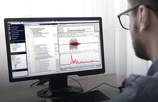 A man with glasses works on analysis in ACQUA