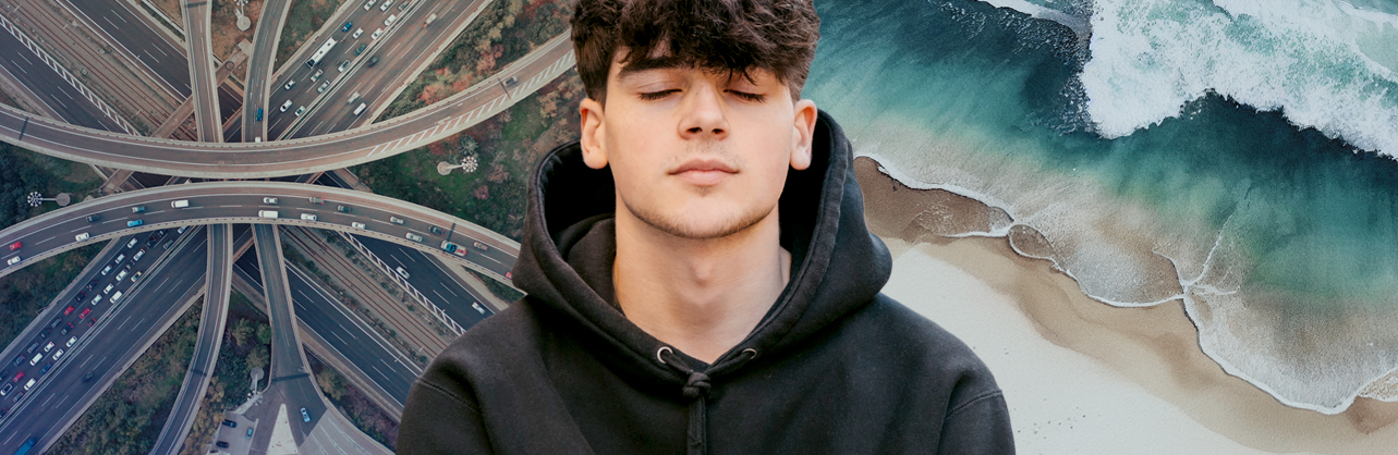 Young man with eyes closed, listenning to the sounds of a highway and to the sound of waves.